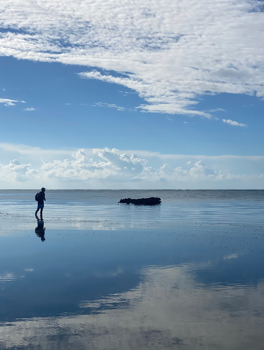DIY fly fishing wading a low-tide flat in Grand Cayman, Cayman Islands