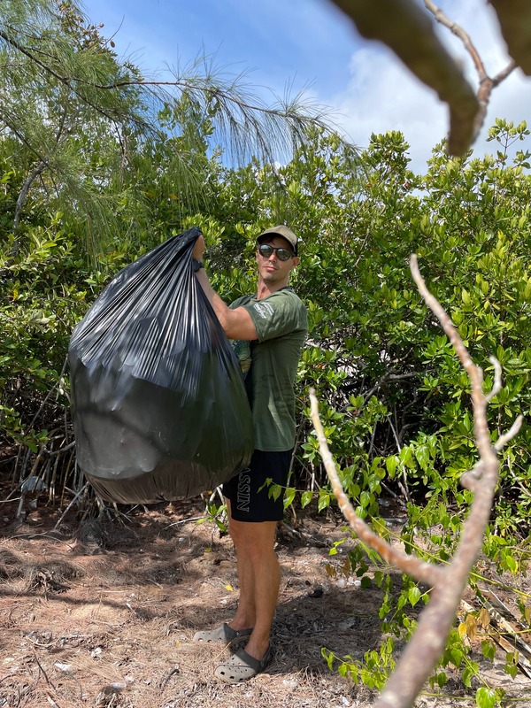 Richard picking up rubbish on Earth Day for the Cayman Clean initiative on Grand Cayman